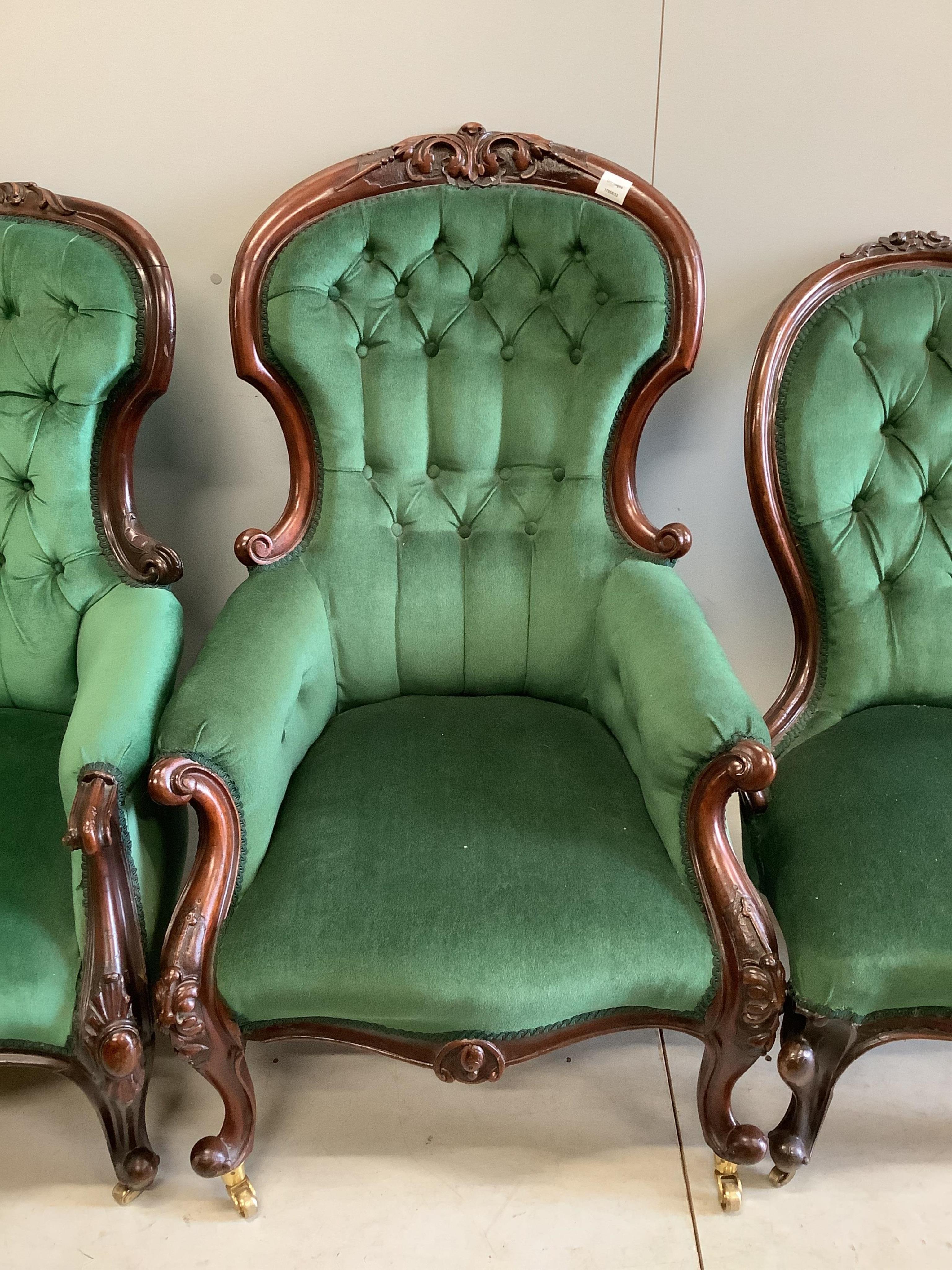 Four Victorian upholstered mahogany spoon back chairs, largest height 110cm. Condition - fair to good